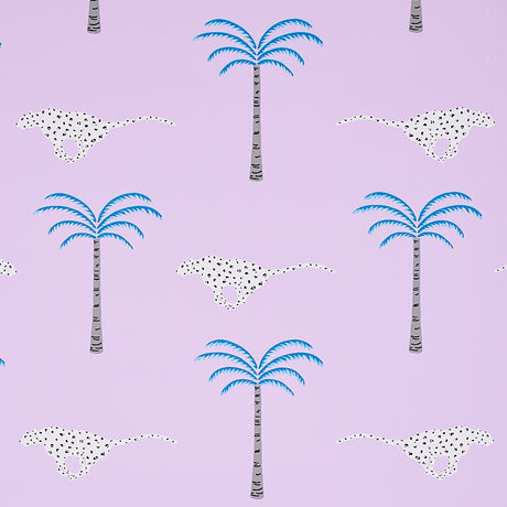 A Wild Desert Dream wallpaper in orchid by Schumacher, featuring playful cheetahs and palm trees on a lavender background.