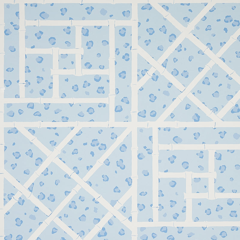 Fancy Beast wallpaper in sky blue by Cristina Buckley for Schumacher, featuring a chic leopard spot and trellis motif.