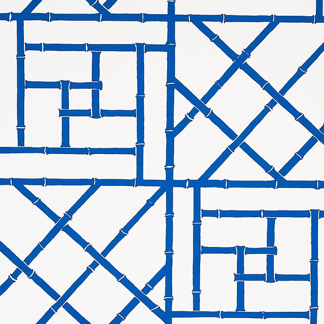 Trellis Indigo by Cristina Buckley for Schumacher - blue bamboo fretwork geometric wallpaper pattern in a modern entryway
