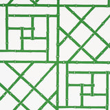 Safari green bamboo trellis pattern wallpaper by Schumacher, designed by Cristina Buckley, shown in a bright entryway.