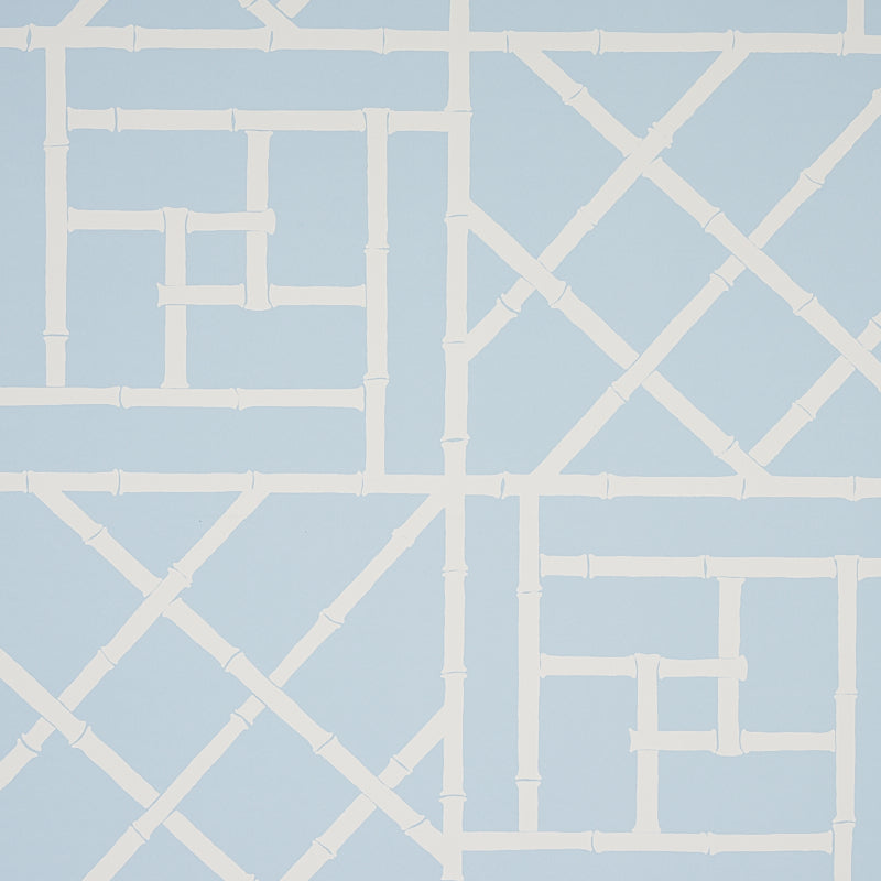 Trellis Sky Blue wallpaper by Cristina Buckley for Schumacher, featuring a bamboo fretwork geometric pattern in light blue and white.