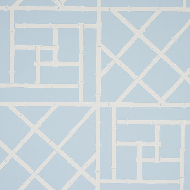 Trellis Sky Blue wallpaper by Cristina Buckley for Schumacher, featuring a bamboo fretwork geometric pattern in light blue and white.