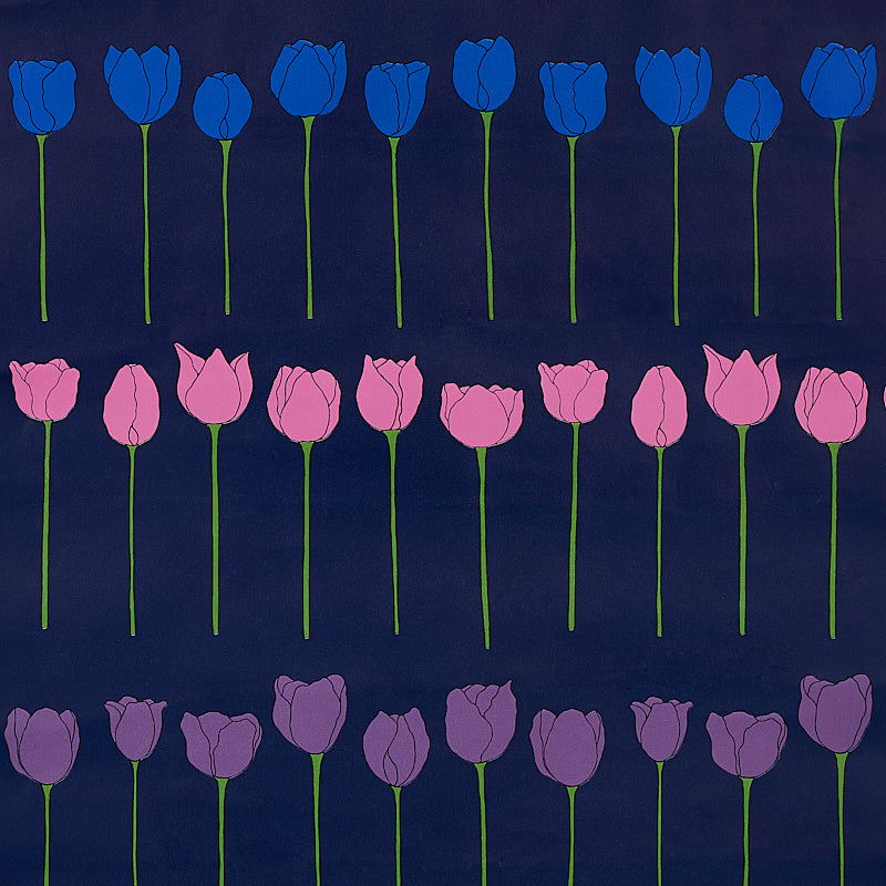 Edie Electric Jewel wallpaper by Cristina Buckley for Schumacher, featuring rows of stylized blue, pink, and purple tulip flowers on a dark background.