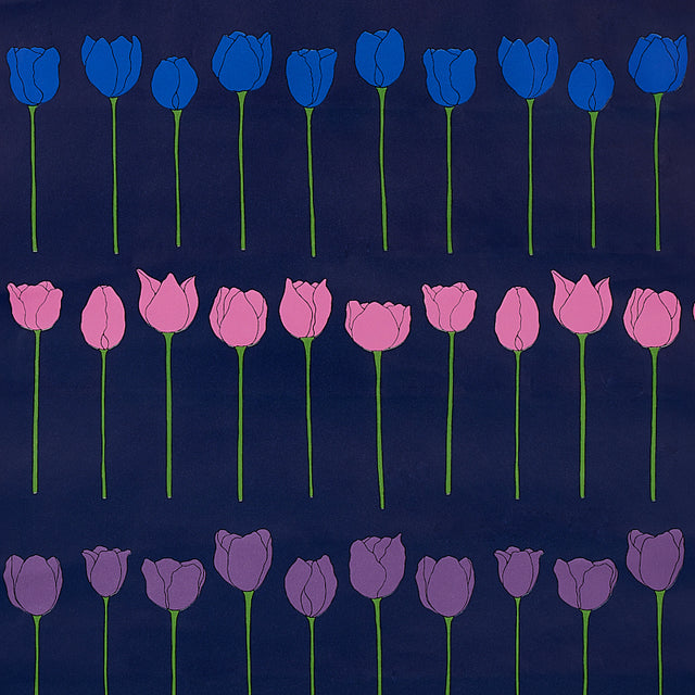 Edie Electric Jewel wallpaper by Cristina Buckley for Schumacher, featuring rows of stylized blue, pink, and purple tulip flowers on a dark background.