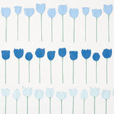 Edie wallpaper in Blue Parrot by Cristina Buckley for Schumacher, featuring rows of stylized blue tulip flowers on a white background.