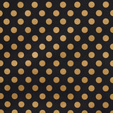 Lady wallpaper by Cristina Buckley for Schumacher in black and gold polka dot pattern, shown in room and close-up views.
