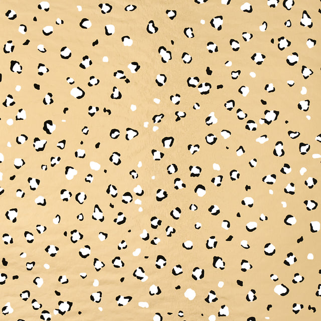 Wild at Heart Metallic wallpaper in Glam Gold by Cristina Buckley for Schumacher, featuring a small-scale animal print pattern with metallic gold background.