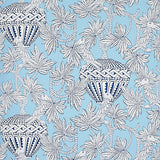 Santarem Sky wallpaper by Schumacher featuring blue and white tropical foliage, parrots, and decorative vases in a whimsical pattern.