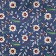 Floralia Sisal Indigo wallpaper by Schumacher, a scrolling botanical floral design on a textured sisal ground.