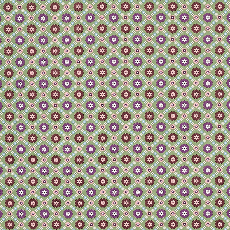 Larissa wallpaper in Jade by Schumacher features an intricate lattice design with folkloric flowers in green, purple, and brown tones.