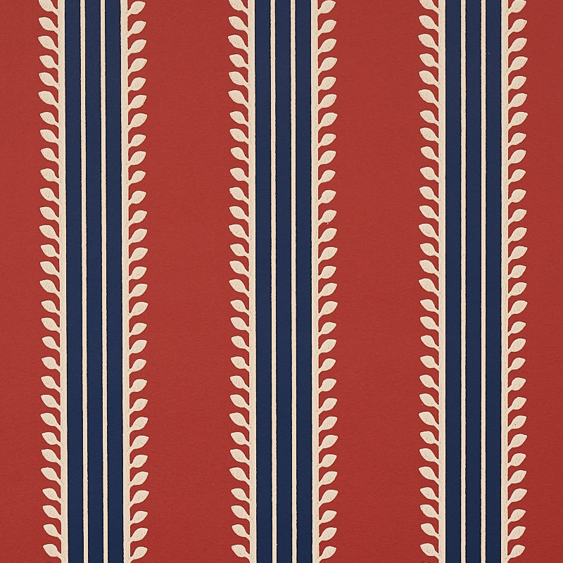 Etruscan Stripe wallpaper in red and blue with multicolored, multiwidth bands and textural details, styled in a classic interior setting.