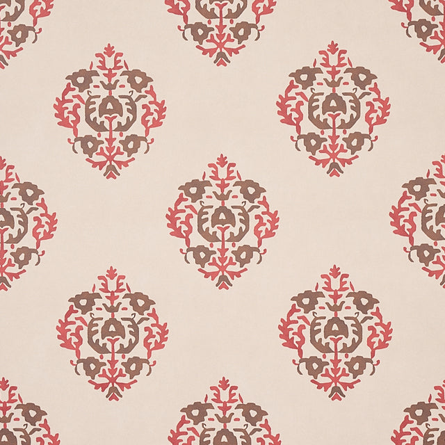 Constantine wallpaper in Jasper by Schumacher, featuring a stylized block print-inspired damask pattern in red and brown tones on a neutral background.