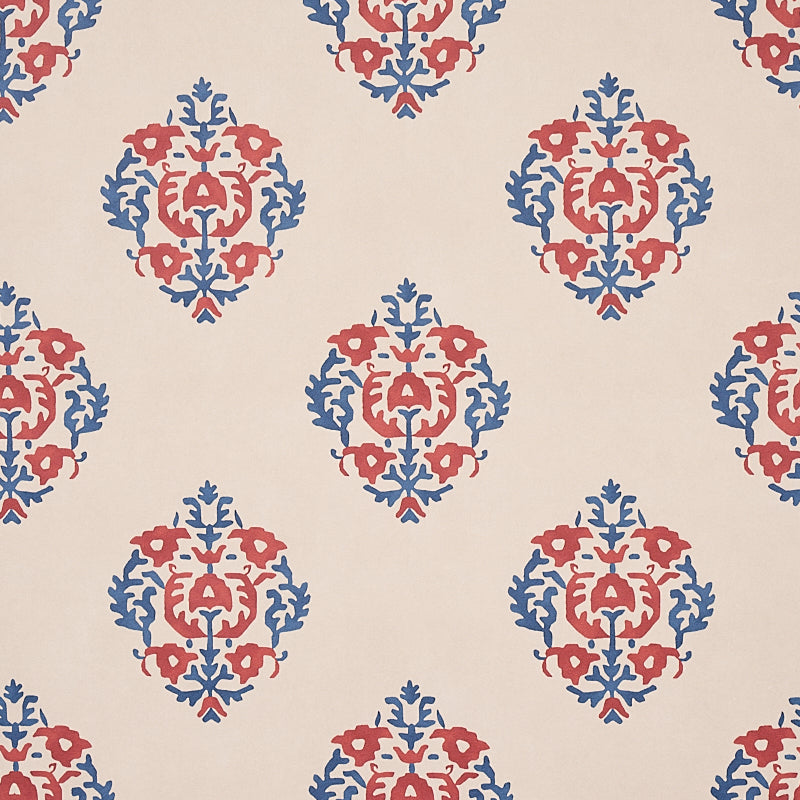 Constantine wallpaper in red and blue by Schumacher, featuring a stylized block print inspired pattern from the Cabana collection.