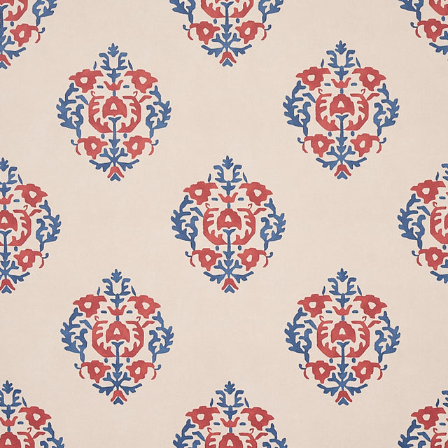Constantine wallpaper in red and blue by Schumacher, featuring a stylized block print inspired pattern from the Cabana collection.