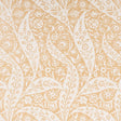 Saz Paisley wallpaper in ochre by Schumacher, large-scale two-tone paisley pattern, styled in a living room setting.