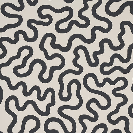 RILEY Soft Black abstract squiggle wallpaper by Schumacher, shown in a modern interior setting.