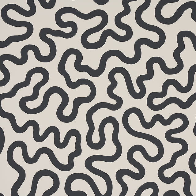 RILEY Soft Black abstract squiggle wallpaper by Schumacher, shown in a modern interior setting.