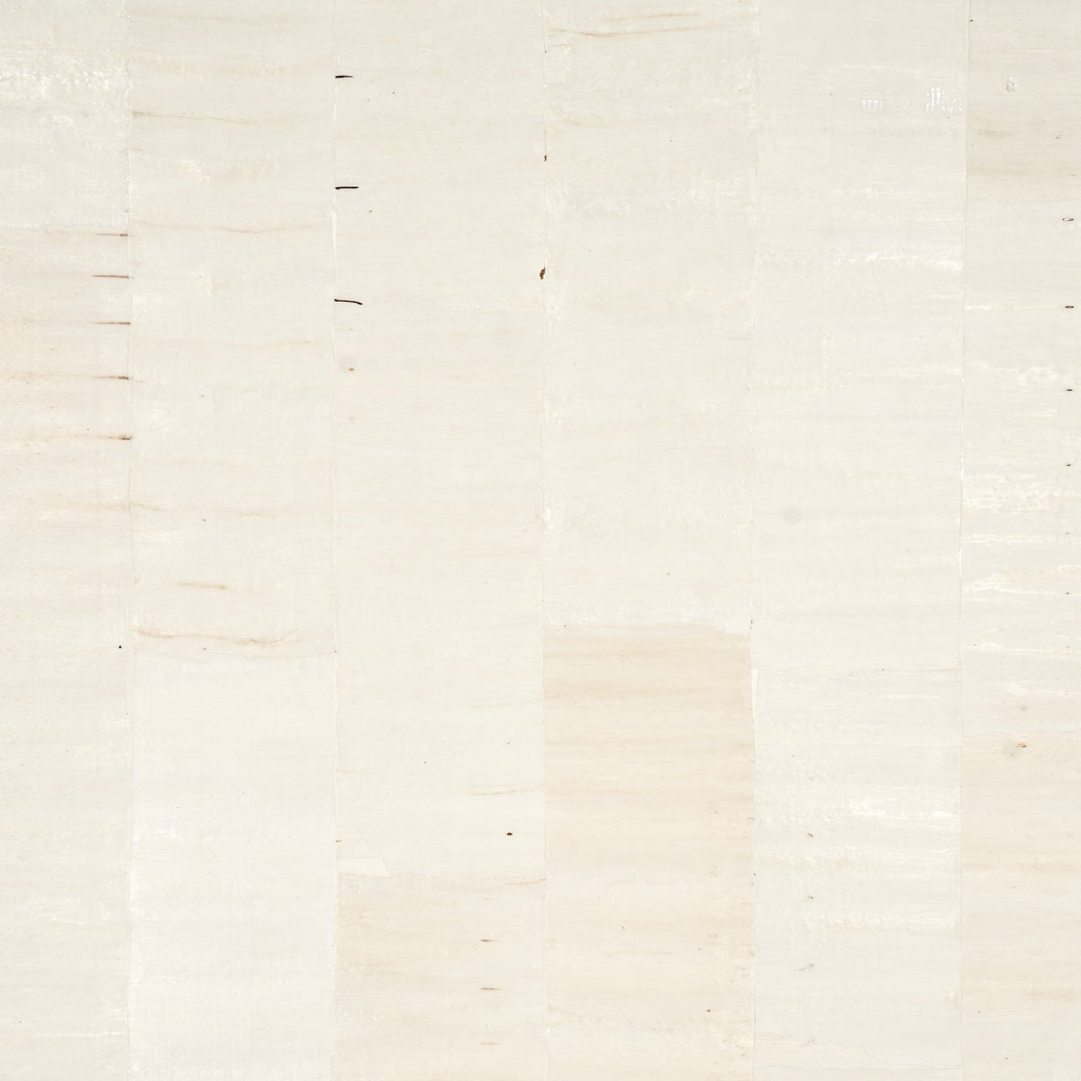 Sano Mosaic white wallcovering with organic, hand-pieced squares and subtle texture by Schumacher