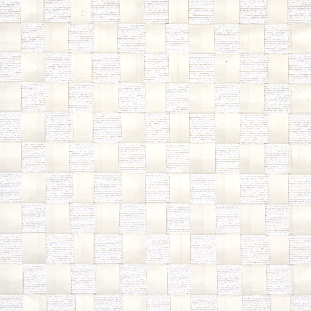 Textured Check wallcovering in white with a handwoven check pattern of flat and rolled paper bands, by Schumacher.