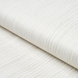 Paper Stripe in white wallcovering by Schumacher, featuring subtle matte and gloss vertical stripes with hand-applied paper strips.