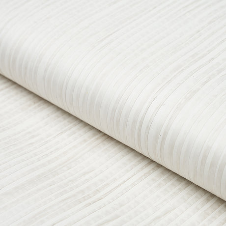 Paper Stripe in white wallcovering by Schumacher, featuring subtle matte and gloss vertical stripes with hand-applied paper strips.
