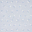 Taylor Blues wallpaper by Schumacher featuring offset-printed bursts of tiny blue dots over a field of larger dots, shown in a modern interior setting.