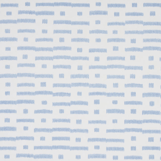 Abstract Ikat Sky wallpaper by Schumacher, featuring a rhythmic broken-stripe pattern in blue on white, shown in a modern living room setting.