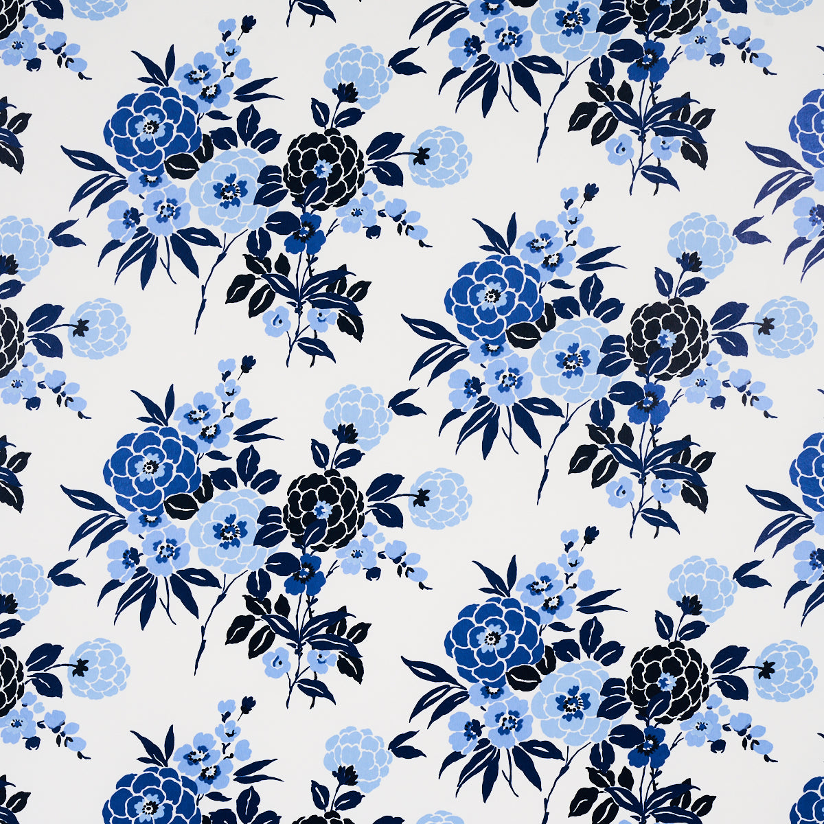 Valentina Floral wallpaper in blues by Schumacher, featuring a modern twist on a traditional floral pattern with graphic blossoms.