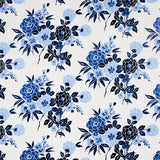 Valentina Floral wallpaper in blues by Schumacher, featuring a modern twist on a traditional floral pattern with graphic blossoms.