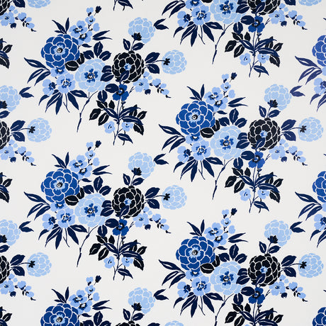 Valentina Floral wallpaper in blues by Schumacher, featuring a modern twist on a traditional floral pattern with graphic blossoms.