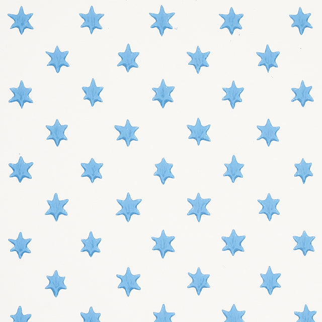 Astral blue wallpaper by Schumacher featuring small six-pointed stars in a repeating pattern, designed by Hobe Erwin.