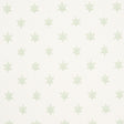 Astral green wallpaper by Schumacher featuring small six-pointed stars in a delicate, celestial pattern.