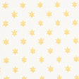 Astral yellow wallpaper by Schumacher featuring small six-pointed stars in a repeating pattern, designed by Hobe Erwin.