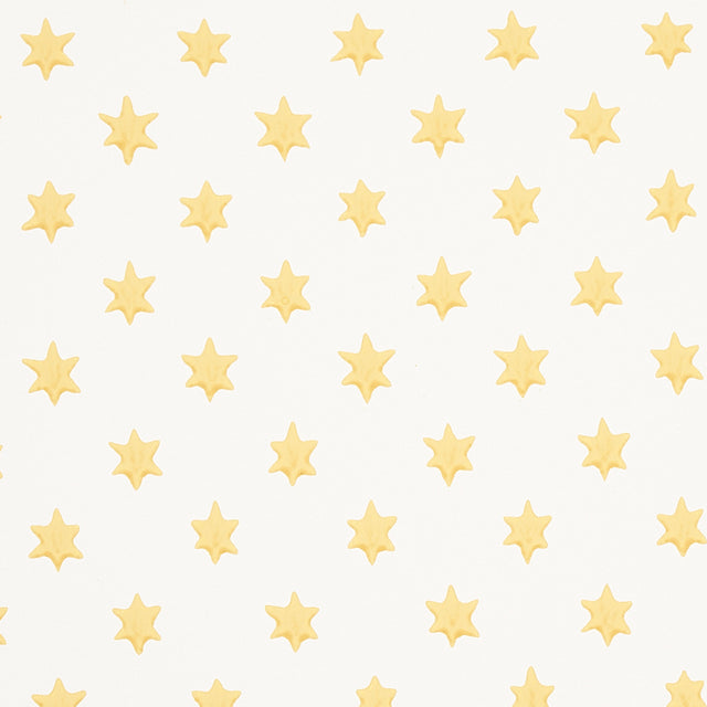 Astral yellow wallpaper by Schumacher featuring small six-pointed stars in a repeating pattern, designed by Hobe Erwin.