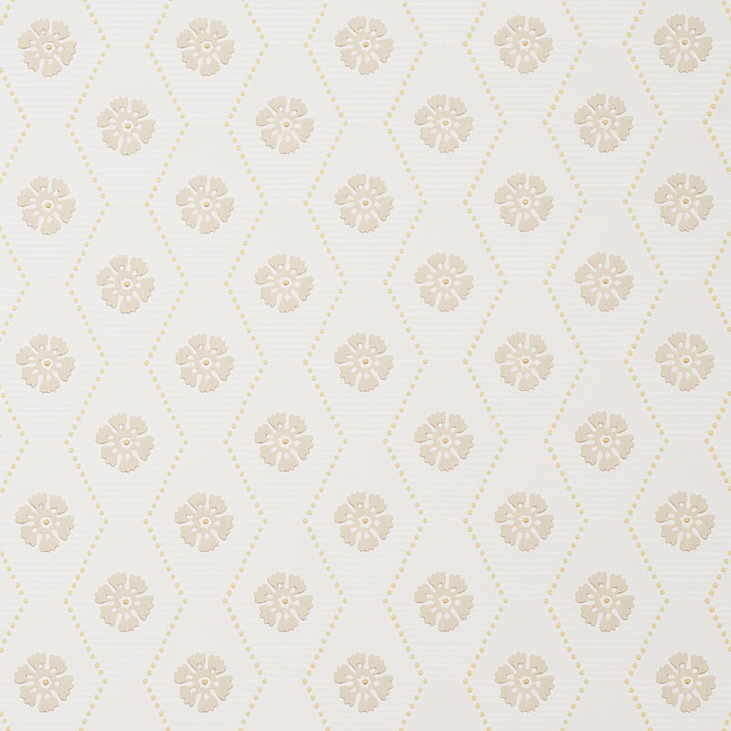 Hive Bloom wallpaper in sand colorway by Schumacher, featuring a geometric floral pattern from the Hobe Erwin collection, shown in a styled bedroom setting.