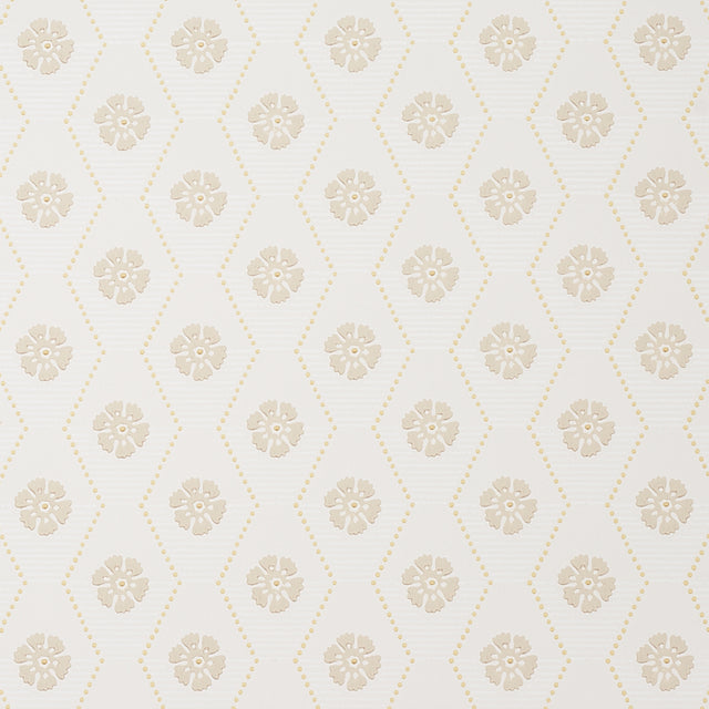 Hive Bloom wallpaper in sand colorway by Schumacher, featuring a geometric floral pattern from the Hobe Erwin collection, shown in a styled bedroom setting.