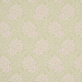 Secret Garden wallpaper in green by Schumacher, featuring leafy floral bouquets and vines in a soft, graphic pattern.
