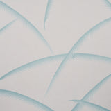 Deco Palms wallpaper in Seaglass by Schumacher, featuring stylized palm fronds in soft blue-green on a light background.