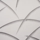 Deco Palms Charcoal wallpaper with stylized palm fronds in a modern Art Deco style by Schumacher