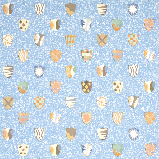 Heraldic wallpaper in Oxford Blue by Happy Menocal for Schumacher, featuring whimsical colorful shields on a mottled blue background.