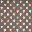 Heraldic wallpaper in brown by Happy Menocal for Schumacher, featuring whimsical colorful shields on a dotted background.