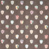 Heraldic wallpaper in brown by Happy Menocal for Schumacher, featuring whimsical colorful shields on a dotted background.