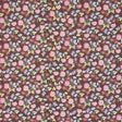 Calico by Happy Menocal for Schumacher - multicolor microfloral wallpaper in multi on brown, shown in detail and installed in a bedroom setting.