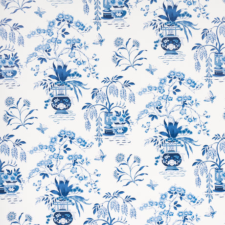 Ming Vase porcelain blue and white chinoiserie floral wallpaper by Schumacher, shown in detail and installed in a room.