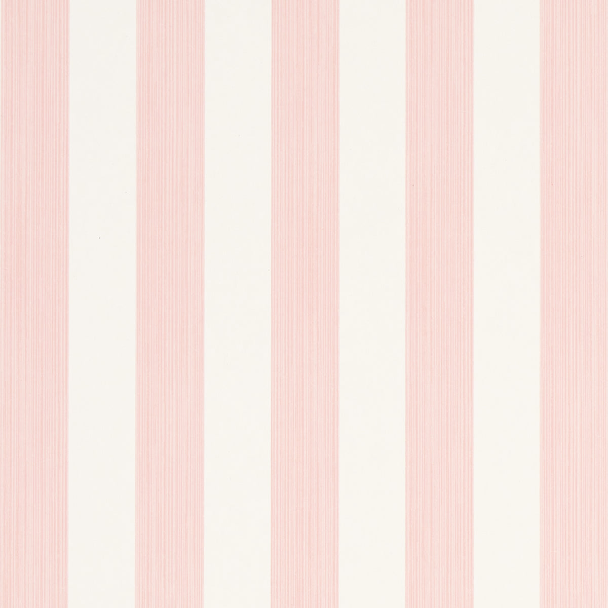 Edwin Stripe Medium wallpaper in Petal by Schumacher, classic pink and white vertical stripes, shown in a bright window nook.
