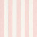 Edwin Stripe Medium wallpaper in Petal by Schumacher, classic pink and white vertical stripes, shown in a bright window nook.