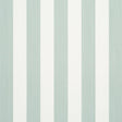 Edwin Stripe Medium wallpaper in Eucalyptus by Schumacher, featuring medium-width green and white vertical stripes, shown in a styled bedroom setting.