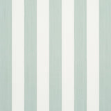 Edwin Stripe Medium wallpaper in Eucalyptus by Schumacher, featuring medium-width green and white vertical stripes, shown in a styled bedroom setting.