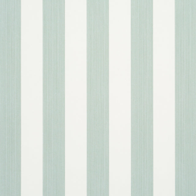 Edwin Stripe Medium wallpaper in Eucalyptus by Schumacher, featuring medium-width green and white vertical stripes, shown in a styled bedroom setting.