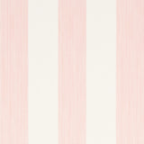 Edwin Stripe Wide wallpaper in Petal by Schumacher, featuring wide pink and white stripes, shown in a bright, classic interior setting.